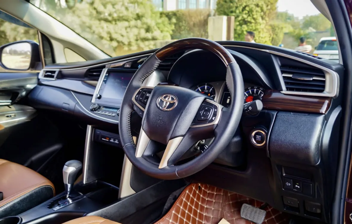 Interior of the Toyota Innova Crysta, showing the comfortable and spacious front cabin.